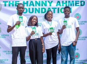 Photo of Staffs and volunteers holding their ID cards.
